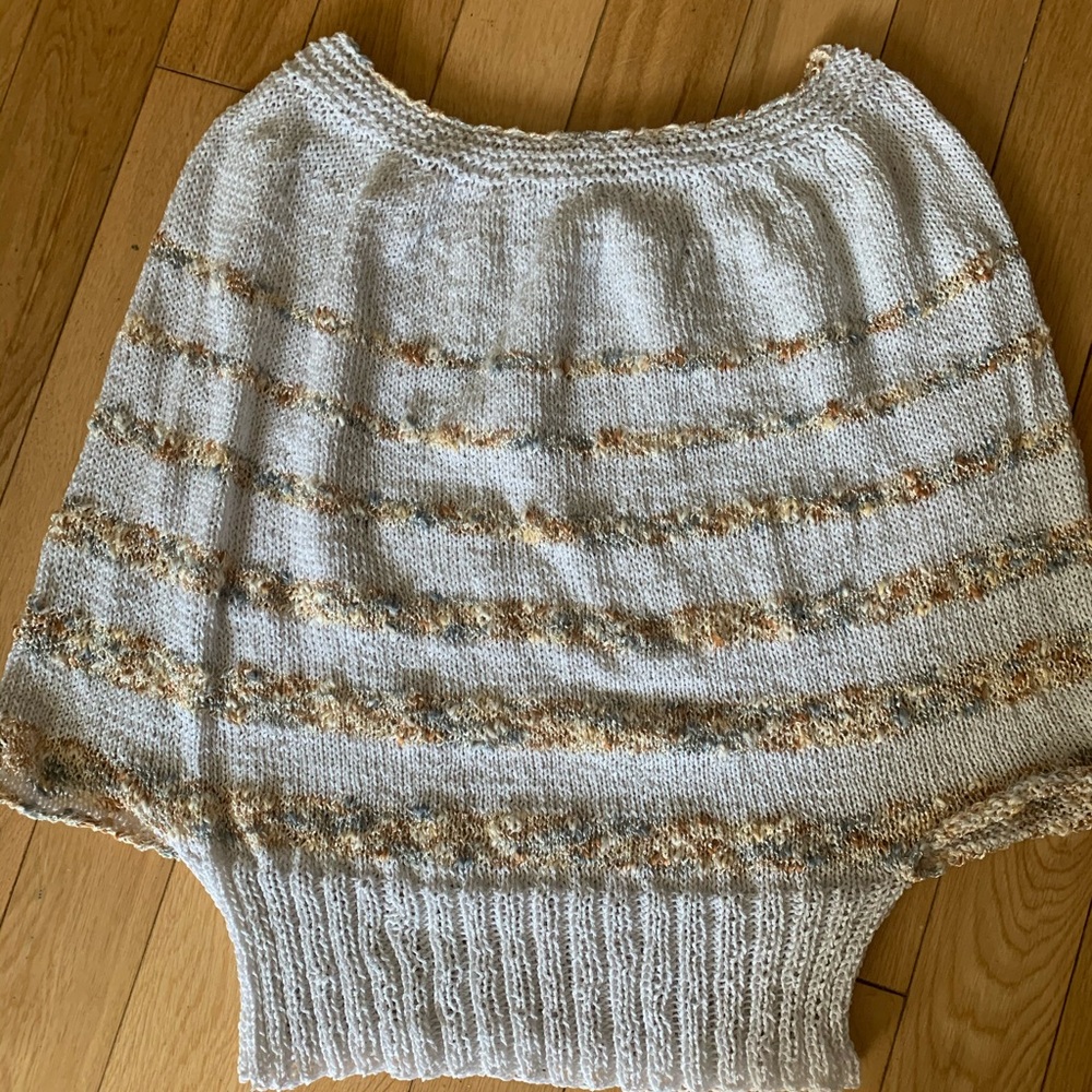 Poncho with a twist